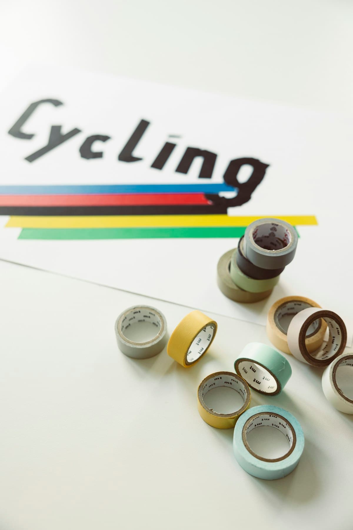 Colourful rolls of material arranged in a workshop; illustrative editorial photography